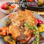 Seasoned pork chop on a plate with roasted vegetables, being drizzled with sauce; text overlay reads "18 Pork Chop Recipes That Go Big on Flavor.