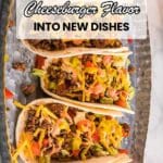 A metal tray with five tacos filled with ground beef, lettuce, cheese, and tomatoes, displayed under text about cheeseburger-inspired dishes.