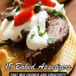 A toasted bread slice topped with meat, cream, sliced red peppers, capers, and herbs. Text on image reads “19 Baked Appetizers That Mix Crunch and Creativity.”.