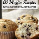 Three chocolate chip muffins are displayed on a plate, one cut open to show the inside, with chocolate chips scattered beside them. Text above promotes 20 muffin recipes.