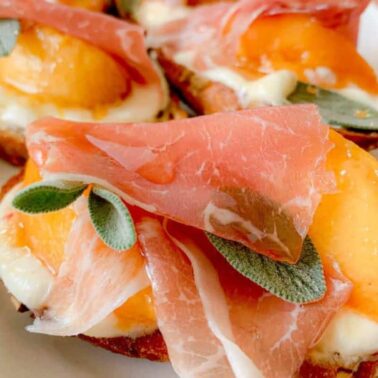 Slices of toasted bread topped with creamy ricotta, melted cheese, peach slices, prosciutto, sage leaves, and a drizzle of honey make this an irresistible addition to your collection of easy ricotta recipes.