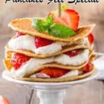 A stack of pancakes with whipped cream and strawberries is served on a white cake stand, with text about special pancake recipes at the top and a logo at the bottom.