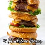 Three stacked cheeseburgers with lettuce, tomato, bacon, and cheddar cheese on sesame seed buns; text reads "12 Blackstone Recipes That Bring Outdoor Flavor Inside.