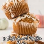 Three crumb-topped muffins with white drizzle are stacked on a white surface. Text overlay reads, "15 Soft-Crumb Muffin Bakes Worth Keeping on Rotation.