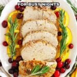 A platter of sliced cooked meat garnished with rosemary, orange slices, and cranberries, with a graphic text overlay reading "16 Easy Crockpot Dinners for Busy Nights.