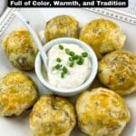 A plate of six golden-brown pastry balls arranged around a bowl of white dipping sauce garnished with chopped green onions.