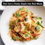 A plate of tofu slices served on rice noodles with red pepper strips and cilantro, captioned "11 Tofu Recipes That Turn a Pantry Staple Into Real Meals.