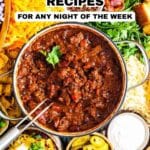 A bowl of chili surrounded by various toppings and side dishes, with text promoting 17 chili recipes for any night of the week.