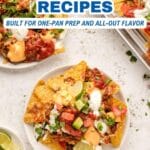 Sheet pan nachos topped with cheese, ground meat, sour cream, chopped tomatoes, jalapenos, and herbs on a white background with lime wedges and text about sheet pan recipes.