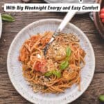 A plate of spaghetti with tomato sauce, fresh basil, and grated cheese is served with a fork on a rustic table. Text overlay reads, "19 Pasta Recipes With Big Weeknight Energy and Easy Comfort.
