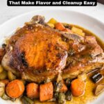 A cooked pork chop served on a white plate with carrots, potatoes, and green beans in a savory sauce. Text overlay reads “19 One-Skillet Dinners That Make Easy Dinner Recipes and Cleanup a Breeze.”.