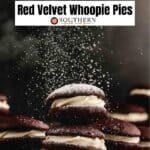 A stack of cookies with powdered sugar.