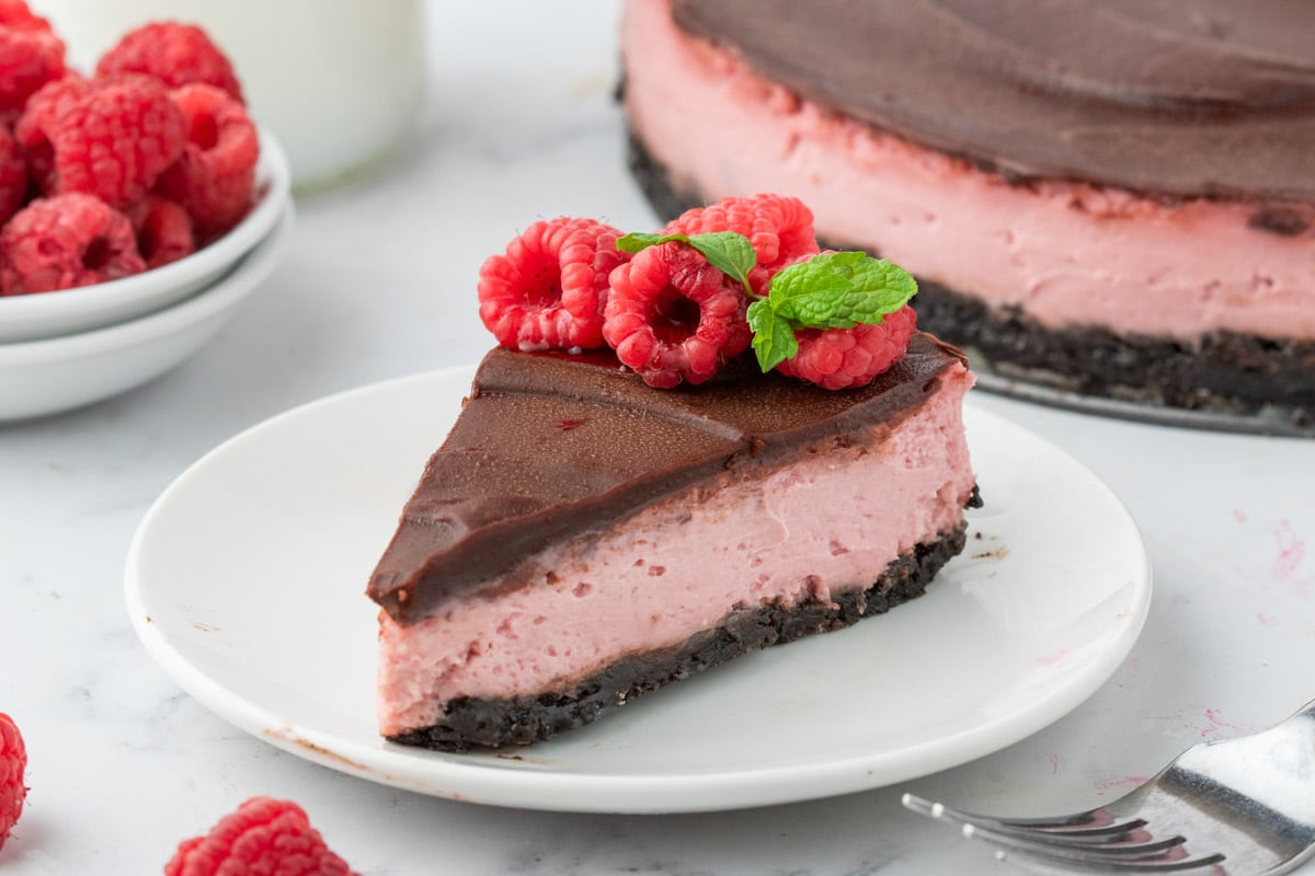 Oreo crust anchors a creamy raspberry puree filling blended with cream cheese and sour cream