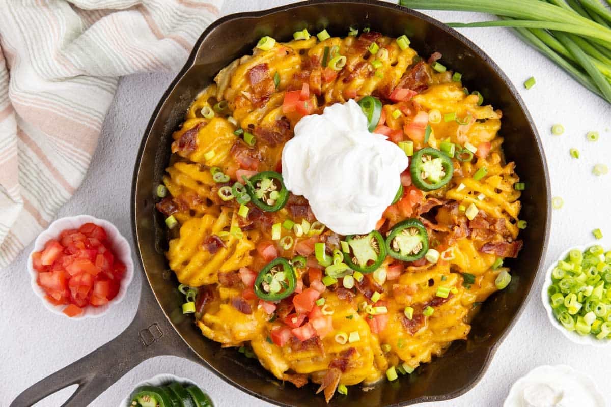 Crispy waffle fries piled high with Guinness cheese, bacon, jalapeños, and sour cream.