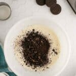 A bowl of food with a mixture of dirt and cookies.