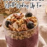 A glass filled with layers of yogurt, blueberry puree, granola, pecans, and blueberries sits on a light cloth with more granola in the background. Text overlay promotes granola recipes.