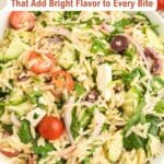 A bowl of orzo pasta salad with cherry tomatoes, olives, cucumbers, red onions, spinach, and feta cheese. Text reads: "13 Salty, Creamy Feta Recipes That Add Bright Flavor to Every Bite.
