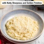 A bowl of mashed potatoes topped with grated parmesan and black pepper sits on a table with a red napkin, spoon, and skillet in the background. Text reads "15 Parmesan Recipes.