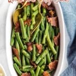 Oval dish of cooked green beans topped with pieces of bacon, served with a gold fork and spoon. Text overlay promotes quick and easy sides for weeknight meals.