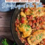 A skillet with savory layers of baked chicken breasts topped with chopped herbs, served on a bed of sautรฉed tomatoes, onions, and peppers, with fresh parsley nearby.