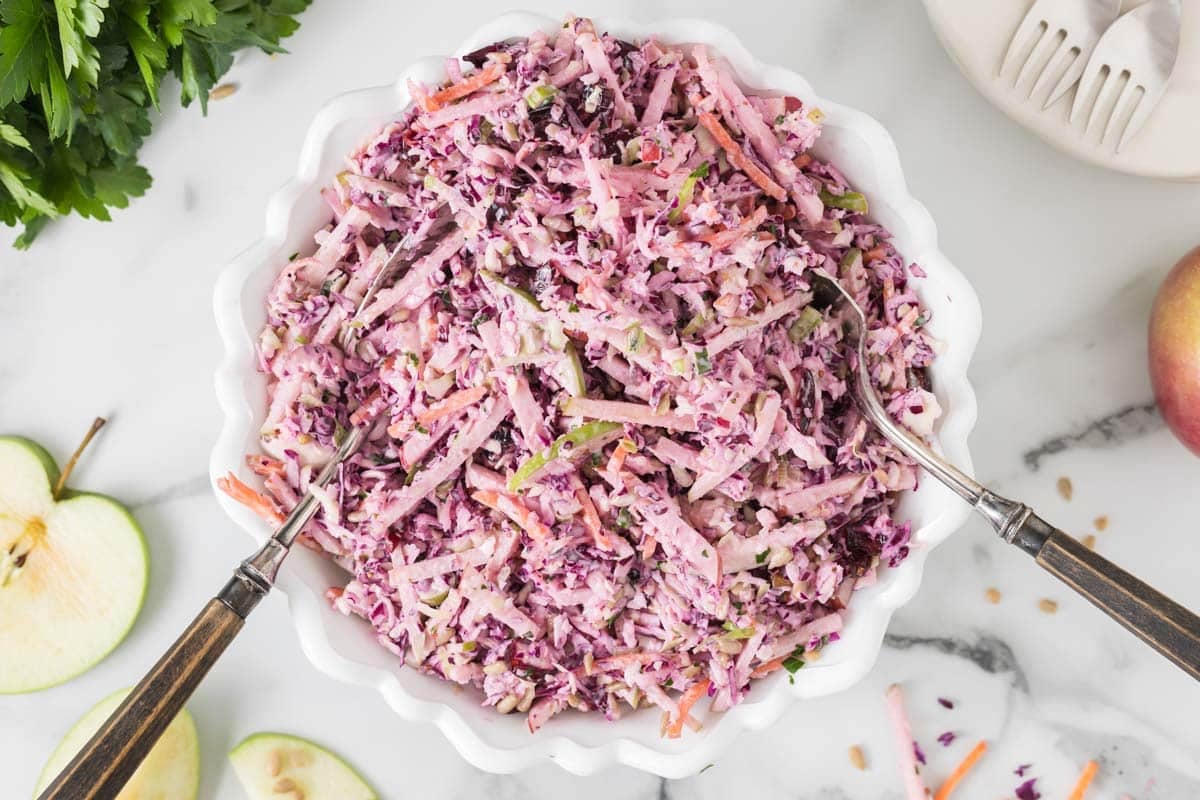 Crunchy apple‑cabbage slaw with tangy creamy dressing—easy, refreshing, and perfect with any meal.