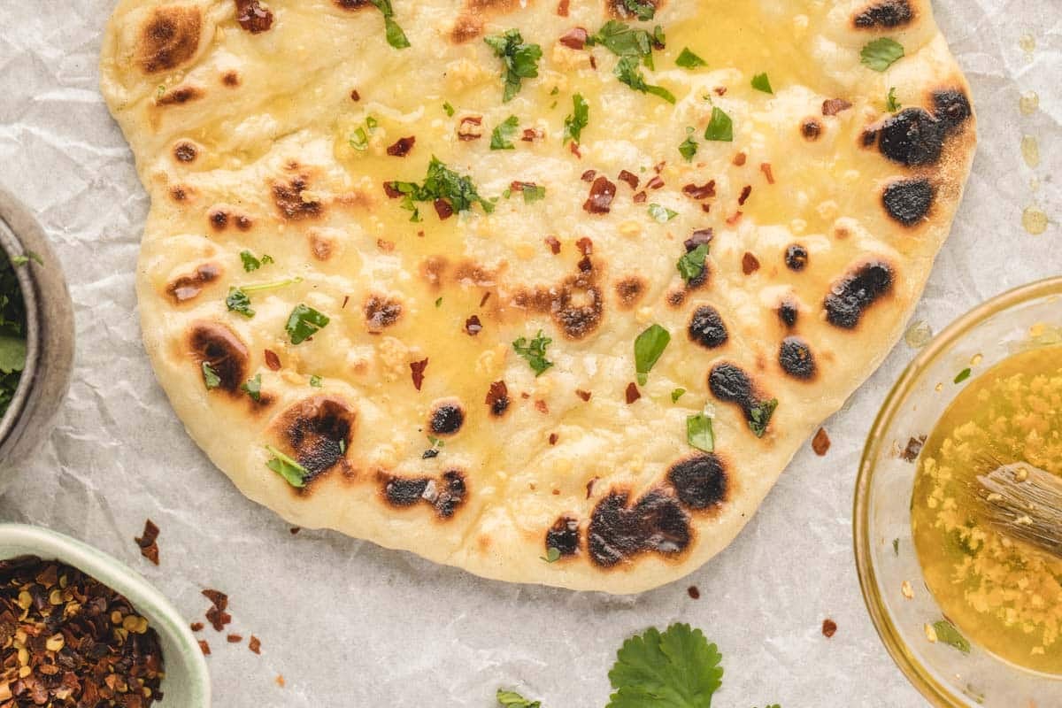 Fluffy, garlicky naan that’s easy to make and perfect for dipping, scooping, or eating solo.