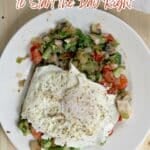 A plate with two fried eggs on top of sautéed vegetables sits on a wooden table. Text above reads, “12 Easy Breakfast Recipes to Start the Day Right.”.