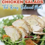 A plate of chicken salad with sliced grilled chicken breast on a bed of greens, garnished with cranberries and sweet potato chunks. Text overlay promotes fresh salads and delicious chicken salad recipes for balanced meals.
