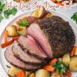 A plate with sliced roast beef, carrots, and potatoes, with text that reads "16 Meals That Turn the Air Fryer Into a One-Step Dinner Tool.
