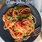 A plate of spaghetti with hearty sauce and fresh herbs on a black dish, placed on a wooden board with a fork on the side. Text overlay promotes classic Italian recipes.