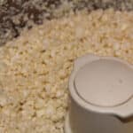 Chopped cauliflower pieces in a food processor.