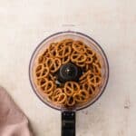 Pretzels in a food processor bowl.