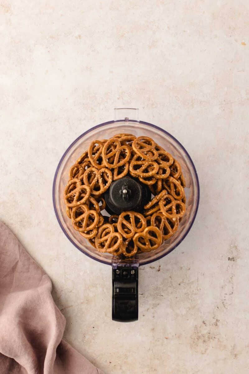 Pretzels in a food processor bowl.