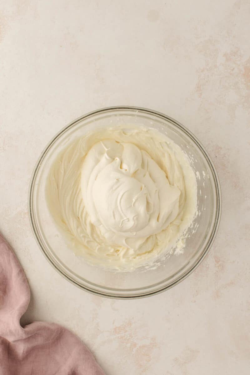 Cream cheese mixture in a clear bowl.