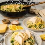 Two plates of creamy lemon chicken orzo with asparagus, topped with sliced chicken breast, are served alongside lemon wedges. A skillet with more pasta and chicken sits in the background.