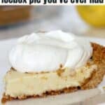 A slice of lemon icebox pie with a graham cracker crust, topped with a large dollop of whipped cream on a white plate.