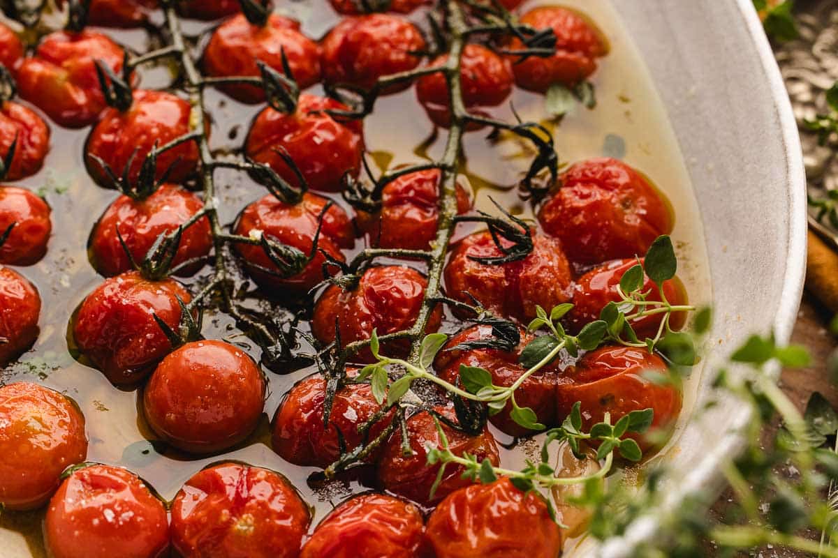Roasted tomato confit, arranged on a white plate.