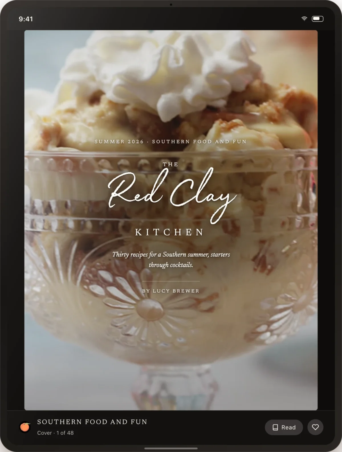 A glass dessert dish filled with ice cream, cake pieces, and whipped cream, shown as the digital cover of a cookbook titled “The Red Clay Kitchen” by Lucy Brewer.