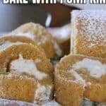 Slices of pumpkin roll cake with cream filling, topped with powdered sugar. Text overlay reads: āHOW TO COOK AND BAKE WITH PUMPKIN.ā